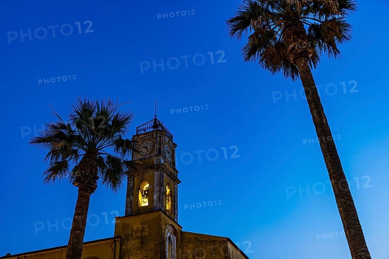 Illuminated steeple of the Madonna del Carmine church, night shot, Porto Azzurro, Elba Island, Tuscan Archipelago National Park, Tuscany, Italy