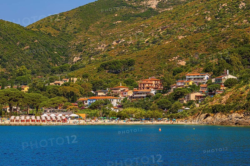 Sunbeds and parasols on the beach of Fetovaia, Elba Island, Tuscan Archipelago National Park, Tuscany, Italy