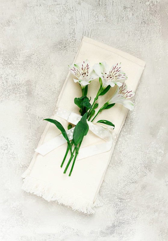 Kitchen towels, cream color, with alstroemeria, Peruvian lily, top view, concept, decor, no people