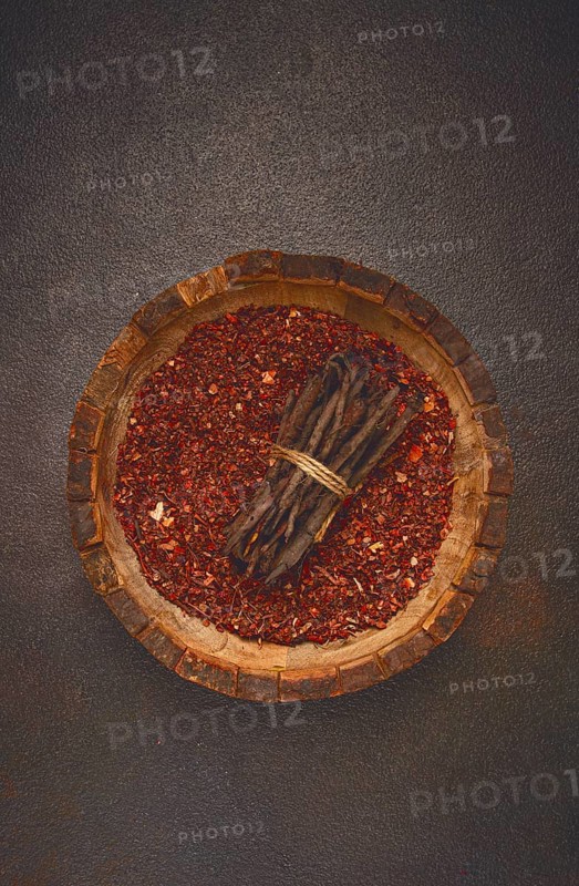 Madder dye, Endro, rhizome for coloring eggs, powder from the roots of endro with onion husks, in a wooden plate, top view, Easter, Georgia