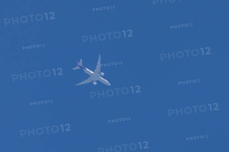 Airbus A300-600RF jet aircraft of FedEx Express airlines in flight in a blue sky, England, United Kingdom