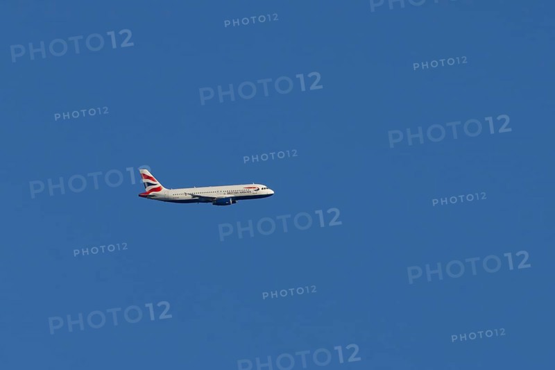 Airbus A320-232 jet passenger aircraft of British Airways airlines in flight in a blue sky, London, England, United Kingdom