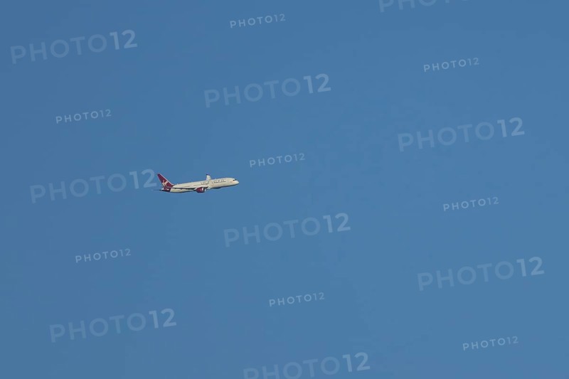 Boeing 787-9 Dreamliner jet passenger aircraft of Virgin Atlantic airlines in flight in a blue sky, England, United Kingdom
