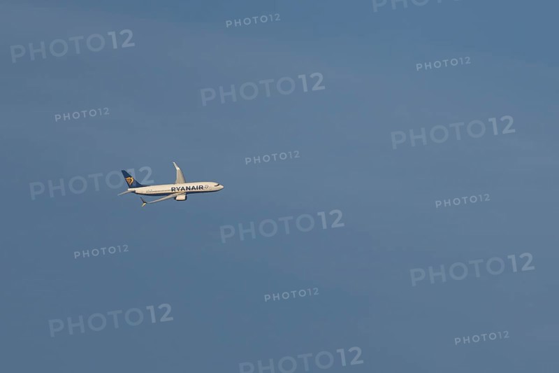 Boeing 737 jet passenger aircraft of Ryanair airlines in flight in a blue sky, Rome, Italy