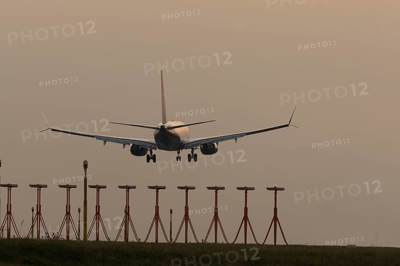 Boeing 737 jet passenger aircraft of Ryanair airlines in flight landing at sunset at London Stansted airport, Essex, England, United Kingdom