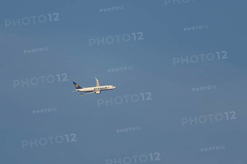 Boeing 737 jet passenger aircraft of Ryanair airlines in flight in a blue sky, Rome, Italy