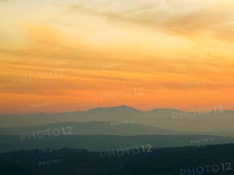 Silhouettes of mountains in the soft light of a pastel-coloured sunset Leiserbergen Weinviertel Lower Austria Austria
