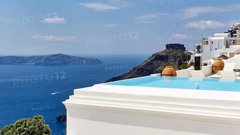 Infinity pool with views of the caldera and the sea, Skaros rock formation, Firostefani, Thira, Santorini, Cyclades, Greece