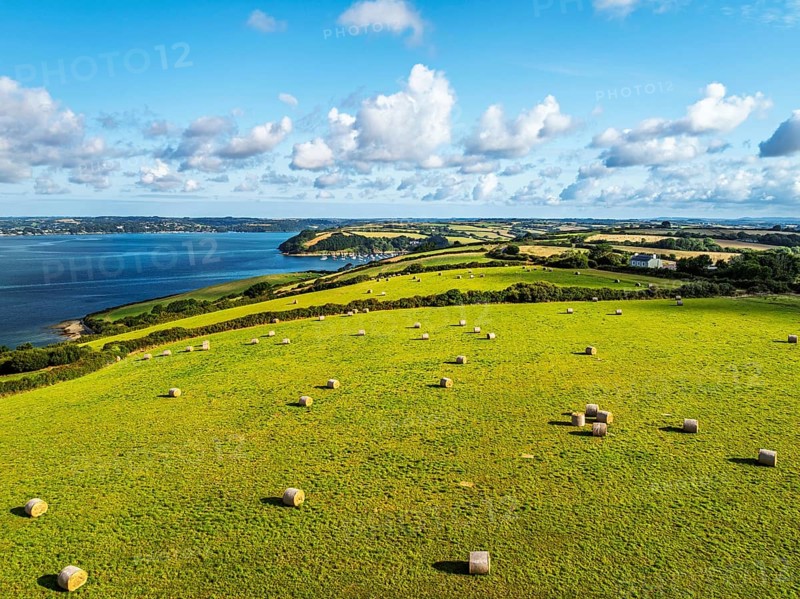 Farms and Fields over St Mawes from drone, Carrick Roads, River Fal, Falmouth, Cornwall, UK