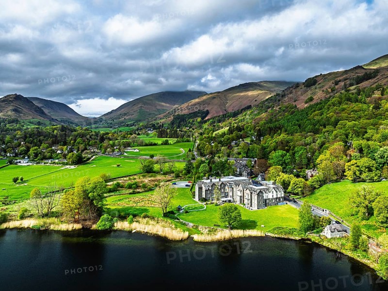Farms and Mountains over road A591 from a drone, Grasmere Lake, Grasmere, Ambleside, Lake District, Westmorland, Cumbria, UK