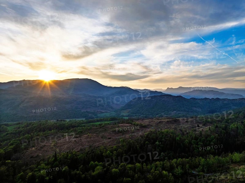 Sunset over Mountains and Coniston Water from drone, Lake District National Park, Cumbria, England, United Kingdom