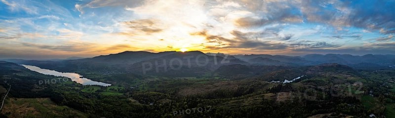 Panorama of Sunset over Mountains and Coniston Water from drone, Lake District National Park, Cumbria, England, United Kingdom