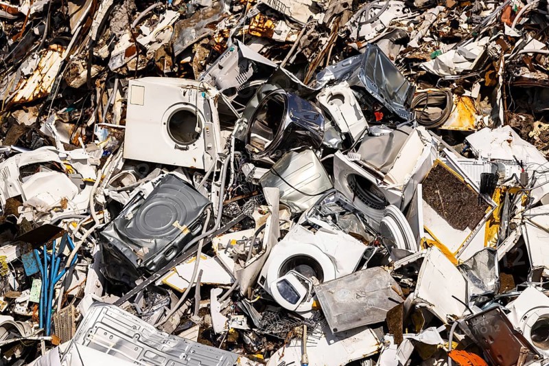 Scrap metal trade in the commercial harbour of Mannheim. Disused household appliances, washing machines and scrap metal. Mannheim, Baden-Württemberg, Germany