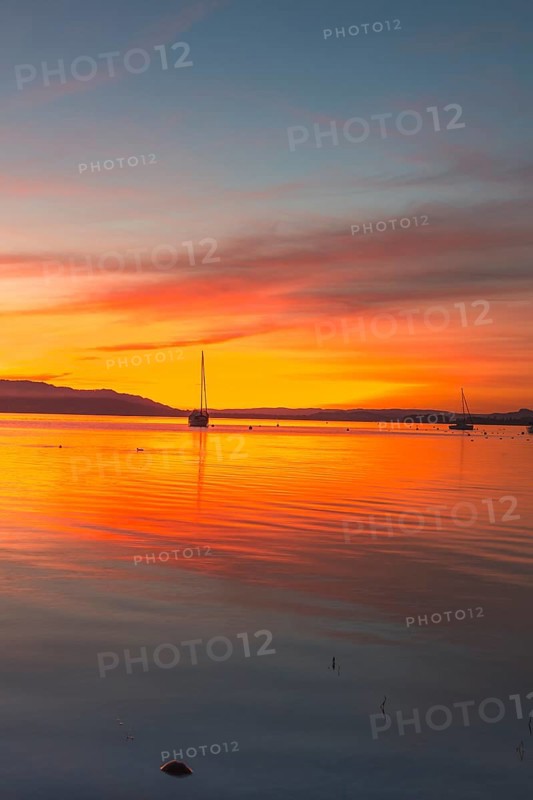 An atmospheric sunset over Lake Constance, Allensbach, Baden-Württemberg, Germany