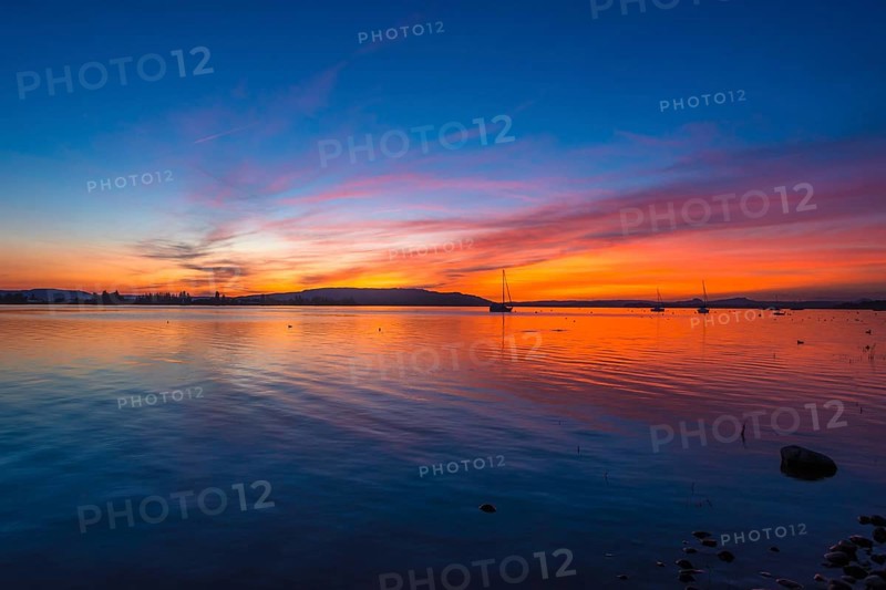 An atmospheric sunset over Lake Constance, Allensbach, Baden-Württemberg, Germany