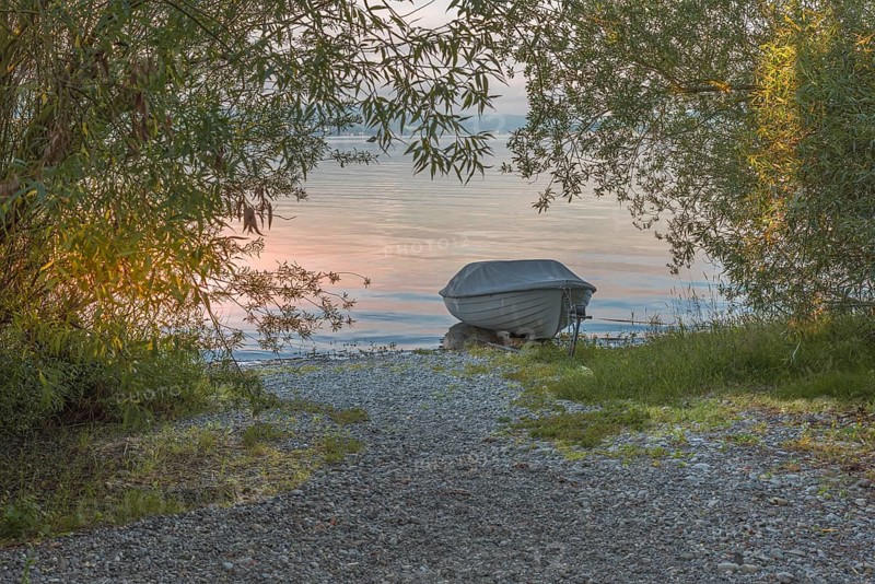 Rowing boat on the shore of Reichenau Island, Lake Constance, Baden-Württemberg, Germany