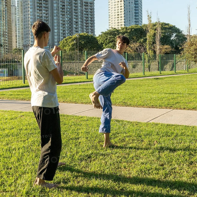 Young martial artists sparring with focus and determination