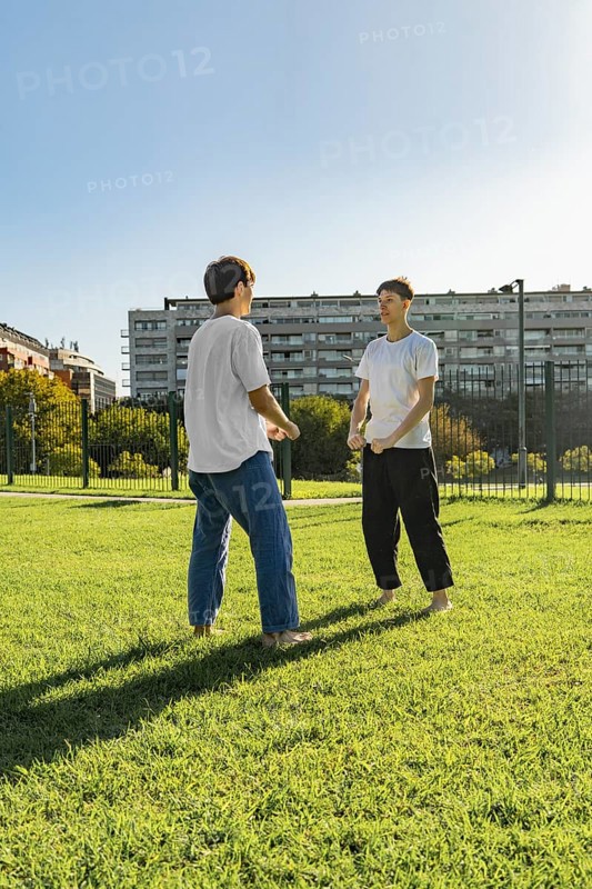Young martial artists greeting each other before a training session