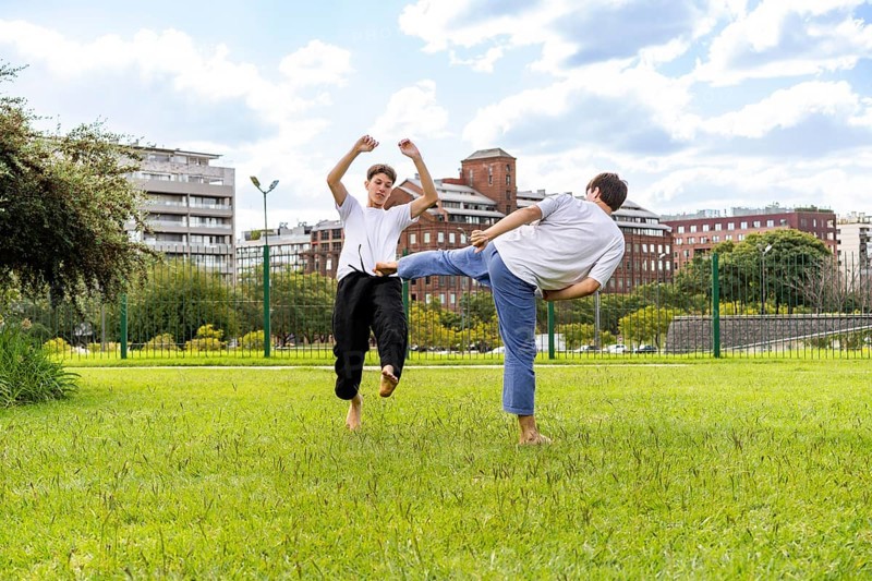 Powerful and graceful Taekwondo motion in a park