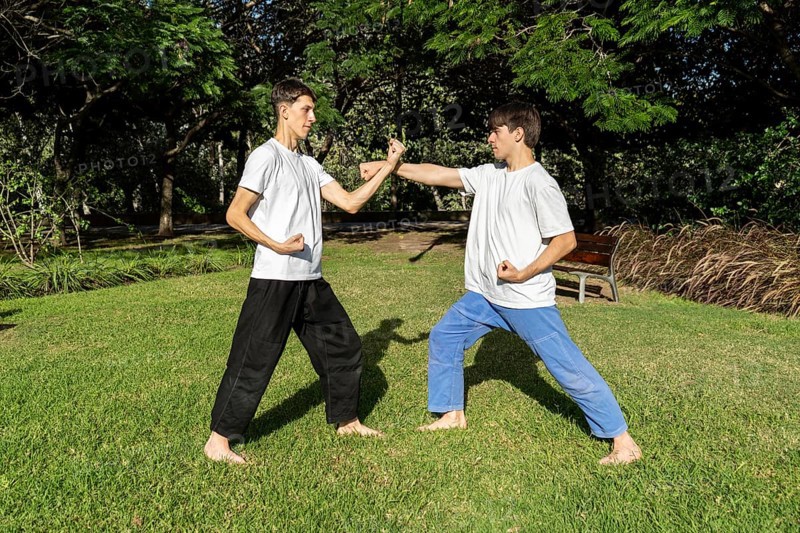 A dynamic Taekwondo session with an urban backdrop