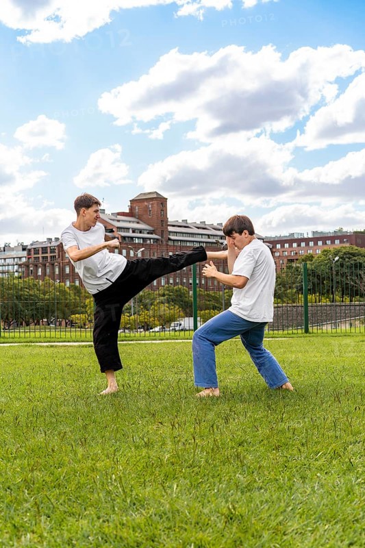 Powerful kicks during an intense Taekwondo practice