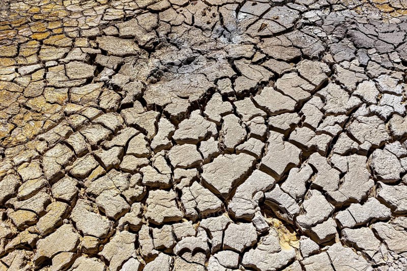 Cracked and dry soil in a volcanic environment, the mud volcanoes and fumaroles on the Altiplano in Bolivia