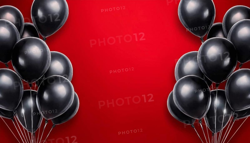 A striking arrangement of black balloons on a vibrant red background with open space in the center, ideal for text or promotional messaging. Perfect for Black Friday and other sales events, AI generated