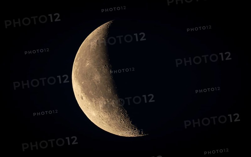 Waxing moon in the clear night sky. Niederursel, Frankfurt am Main, Hesse, Germany