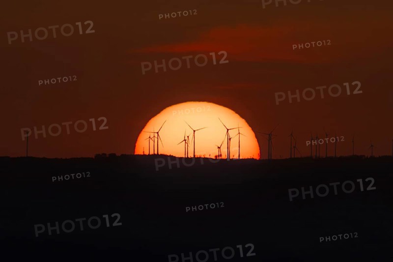 Sunset over a wind farm. Großer Feldberg in the Taunus, Hesse, Germany