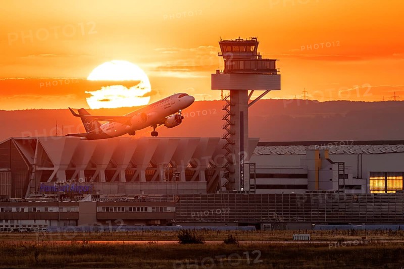 Departure between tower and sunset. Frankfurt Airport, Hesse, Germany