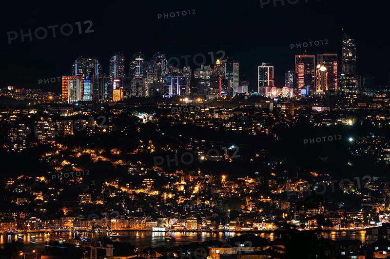 Sparkling skyline meets vibrant city lights on the Bosphorus. Istanbul, Turkey