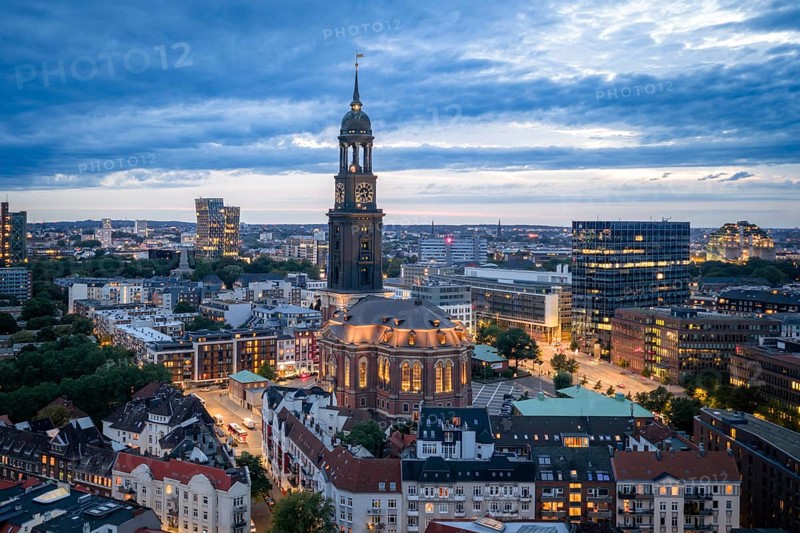 Aerial view of the main church St. Michaelis with a view of Reeperbahn, Dancing Towers and Bunker Hamburg at blue hour, Hamburg, Germany