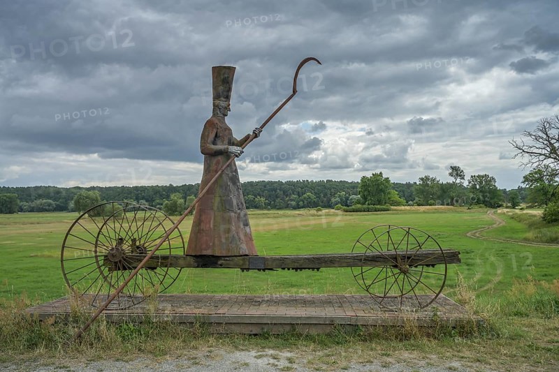 Sculpture Charon ferryman into the underworld, dyke near Mödlich, Brandenburg, Germany