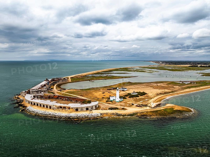 Hurst Point Lighthouse and Hurst Castle from drone over Hurst Spit, Milford on Sea, Lymington, Hampshire, England, United Kingdom