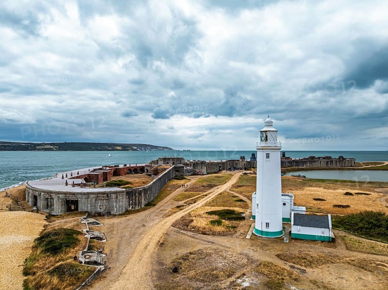 Hurst Point Lighthouse and Hurst Castle from drone over Hurst Spit, Milford on Sea, Lymington, Hampshire, England, United Kingdom