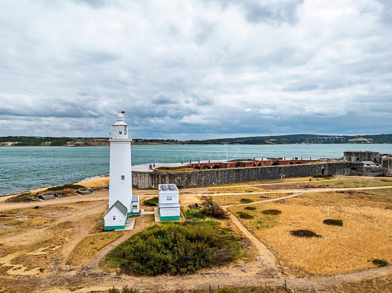 Hurst Point Lighthouse and Hurst Castle from drone over Hurst Spit, Milford on Sea, Lymington, Hampshire, England, United Kingdom