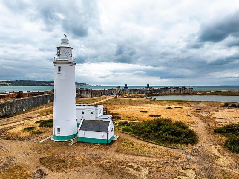 Hurst Point Lighthouse and Hurst Castle from drone over Hurst Spit, Milford on Sea, Lymington, Hampshire, England, United Kingdom