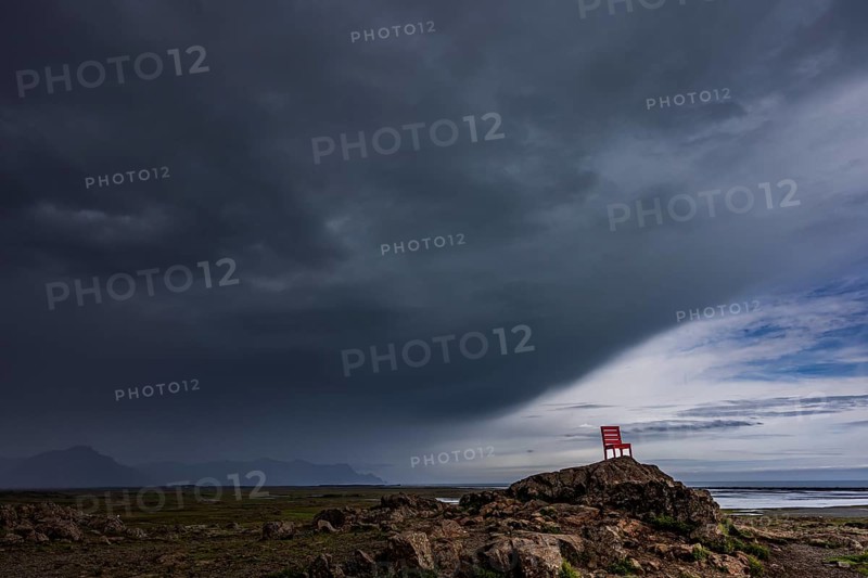 Red chair, artwork, rocks, clouds, storm, rain clouds, coast, mountains, summer, Lón, south-east Iceland, Iceland