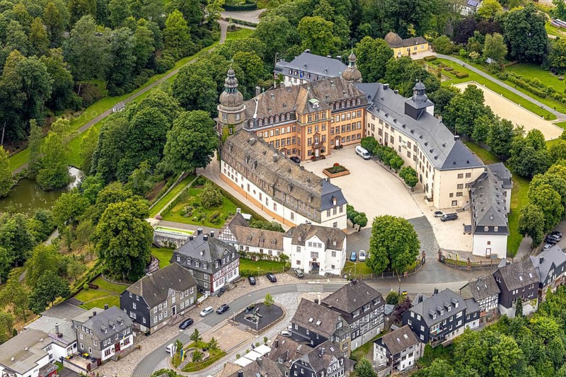 Aerial view, Berleburg Castle, residence castle of the Sayn-Wittgenstein family, Bad Berleburg, Wittgensteiner Land, North Rhine-Westphalia, Germany, aristocratic family, architecture, exterior view, castle, trees, monument, drone image, Sayn-Wittgenstein family, building, green area, local history, sky, cultural heritage, landscape, Middle Ages, panorama, park, region, residence castle, castle, sight, summer, tourism, forest, European, historical