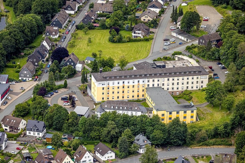 Aerial view, VAMED Klinik Bad Berleburg Hospital, Bad Berleburg, Wittgensteiner Land, North Rhine-Westphalia, Germany, arrangement, architecture, exterior, trees, roof, services, building, terrain, health care, health care system, sky, infrastructure, institution, clinic, hospital, landscape, care facility, region, summer, city, streets, day, surroundings, VAMED Klinik Bad Berleburg, supply, forest, medical
