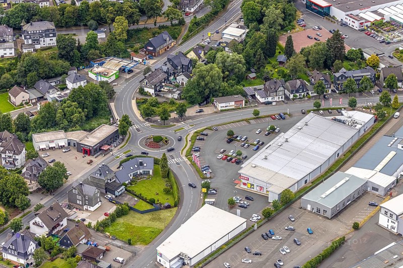 Aerial view, roundabout Poststrasse and Astenberger Strasse, Rewe supermarket, Bad Berleburg, Wittgensteiner Land, North Rhine-Westphalia, Germany, architecture, asphalt, Astenberger Strasse, shopping trolley, shopping centre, retail, vehicles, building, commercial, commercial area, sky, infrastructure, infrastructure planning, roundabout, parking, Poststrasse, region, town, roads, road junction, urban, traffic, traffic junction, Westphalia, European, local
