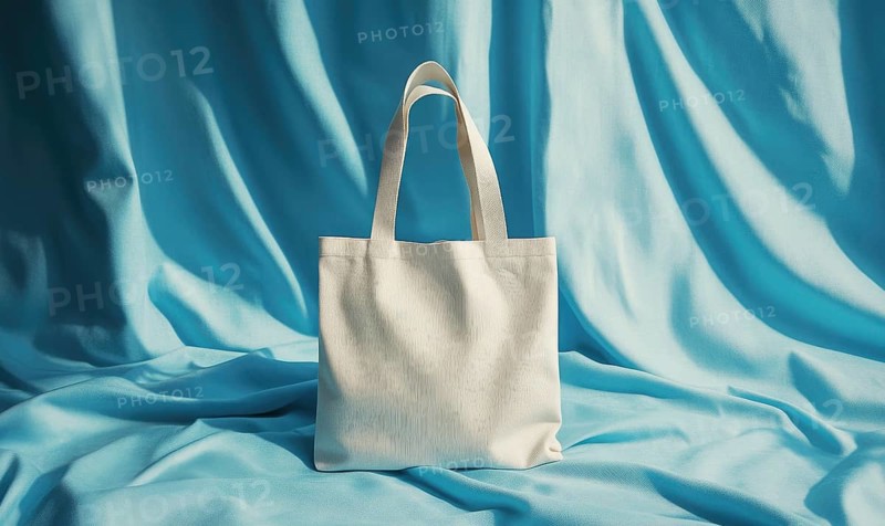 A white purse is on a blue background. The purse is the main focus of the image. The blue background creates a calm and serene mood. AI generated