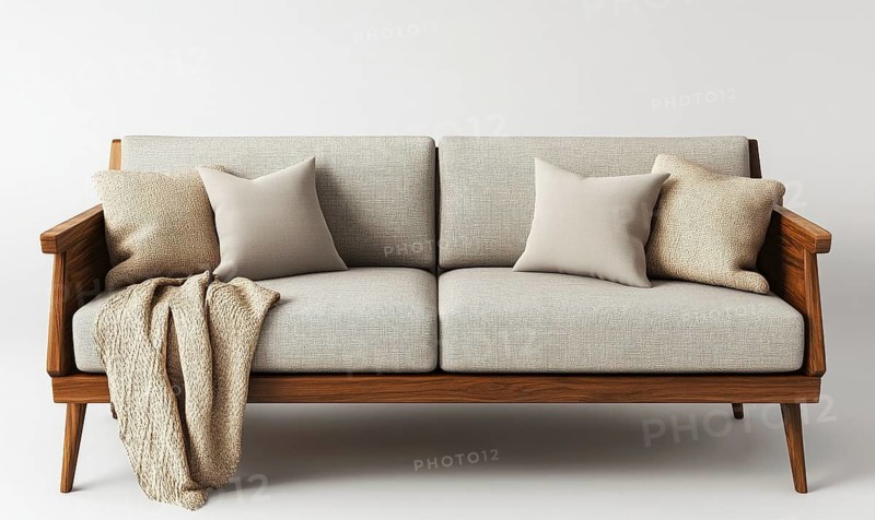 A brown couch with pillows and a blanket on it. The couch is made of wood and has a modern design. The pillows are white and arranged in a way that creates a cozy and inviting atmosphere. AI generated