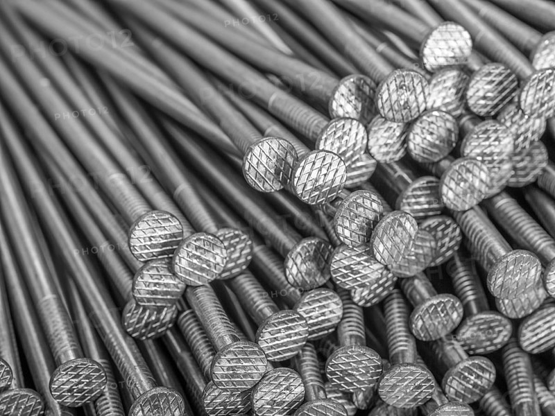 Full frame background showing lots of metallic nails