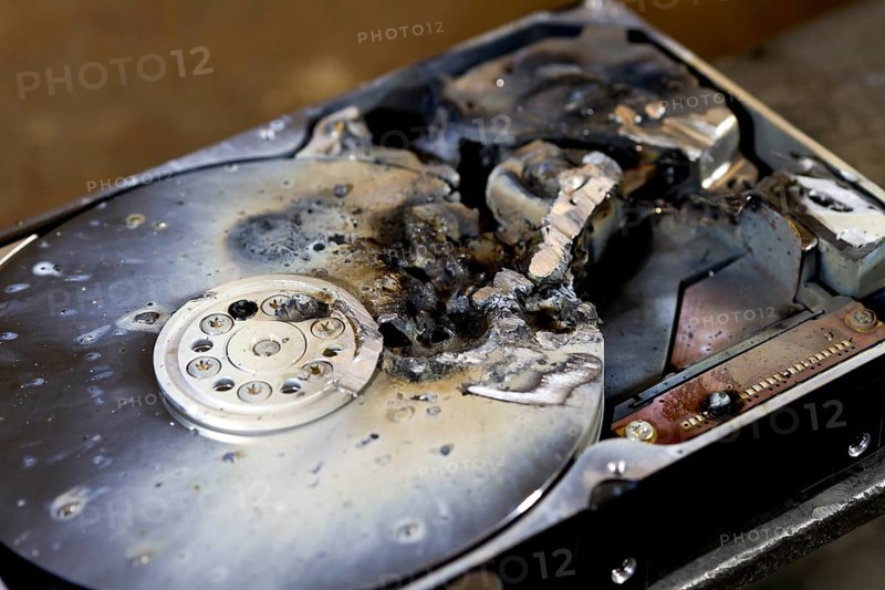 Detail shot of a massive destroyed hard disk drive