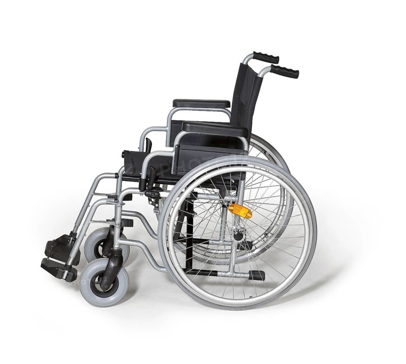 Studio photography of a empty wheelchair in white back with shadow