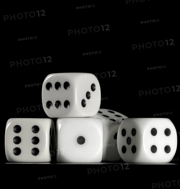 Surface angle closeup studio photography of some dice in dark back