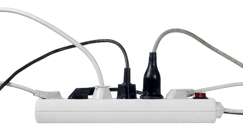 Studio photography of a multiple socket and connected plugs isolated on white with clipping path