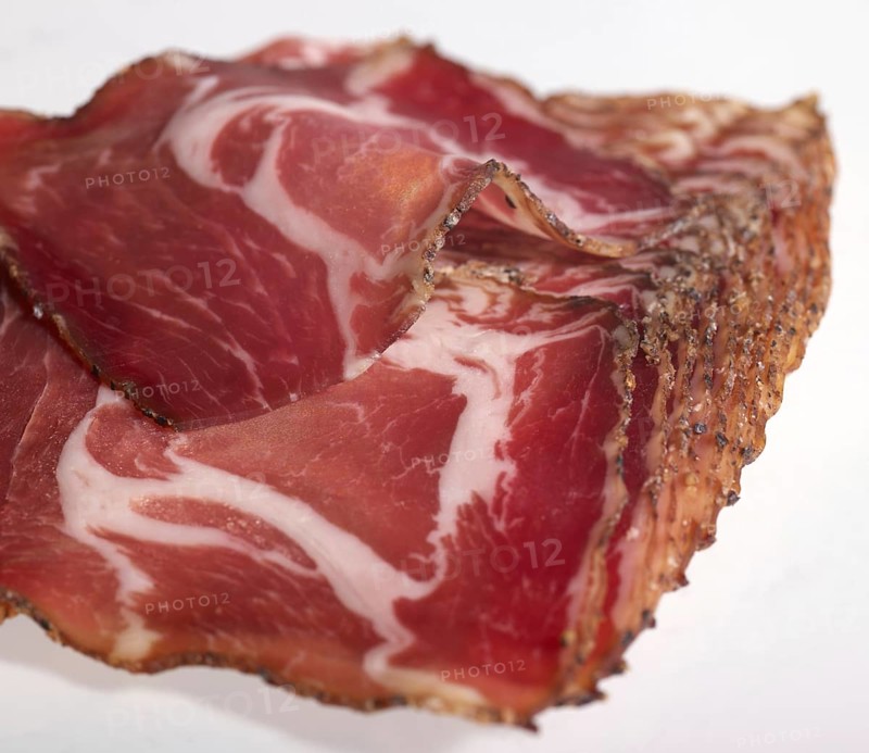 Closeup shot showing sliced raw ham pieces