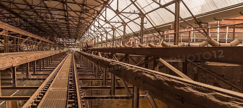 Weathered rusty industrial scenery with old rundown, steel girders and appliances